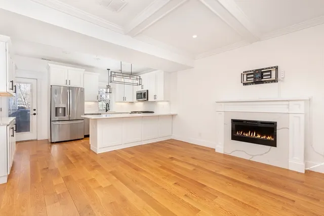a view of a kitchen with a stove cabinets and wooden floor