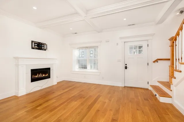a bedroom with a bed and a fireplace