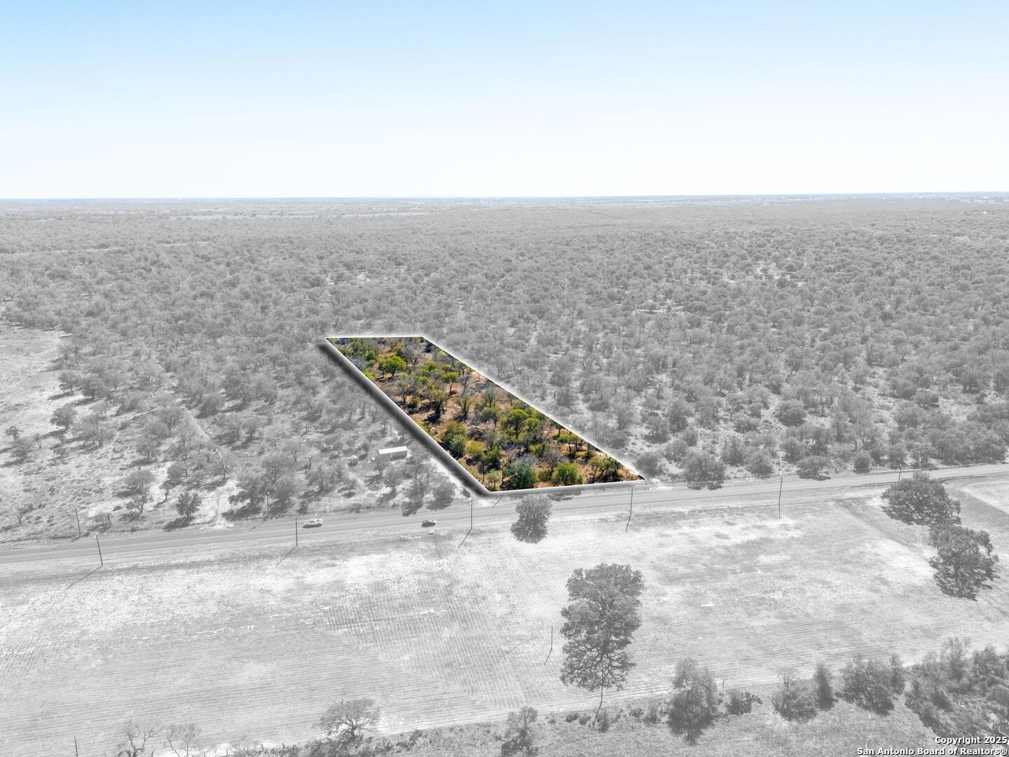 21270 Priest Road Elmendorf, TX 78112 - Photo 11 of 14 an empty room with wooden floor