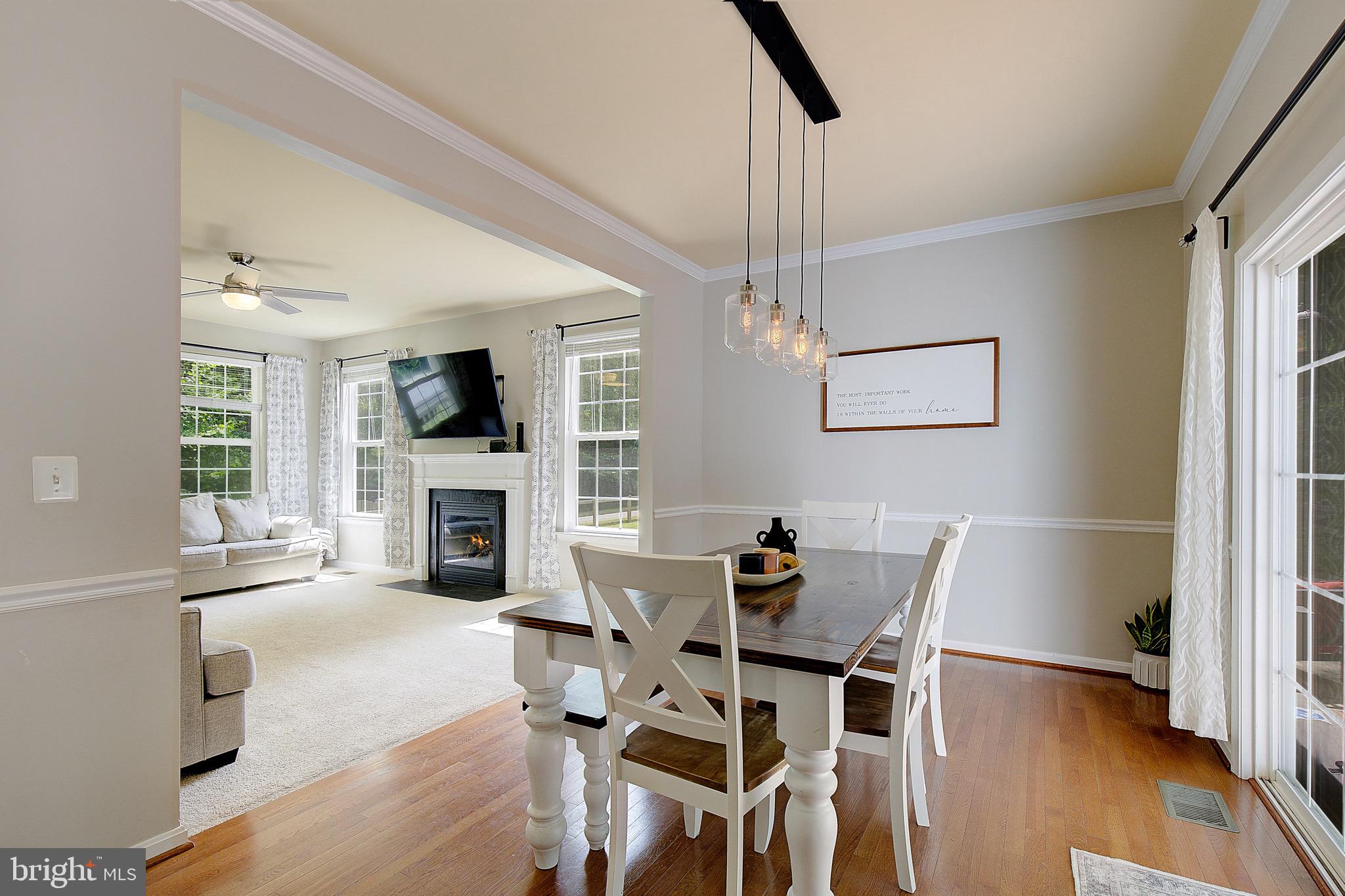 650 Stratton Place Prince Frederick, MD 20678 - Photo 12 of 51 a view of a dining room with furniture window and wooden floor