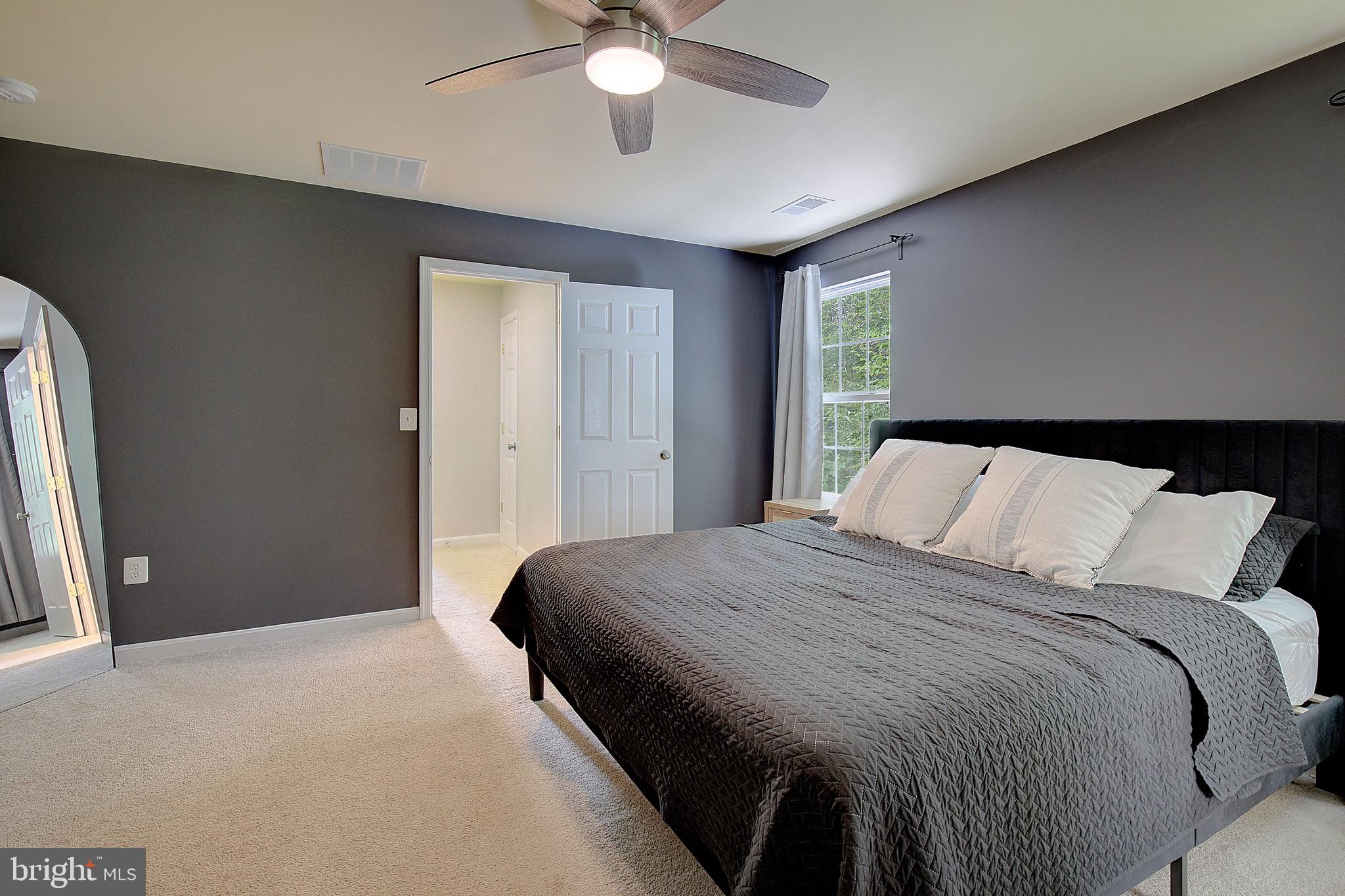 650 Stratton Place Prince Frederick, MD 20678 - Photo 27 of 51 a bedroom with a bed and a window