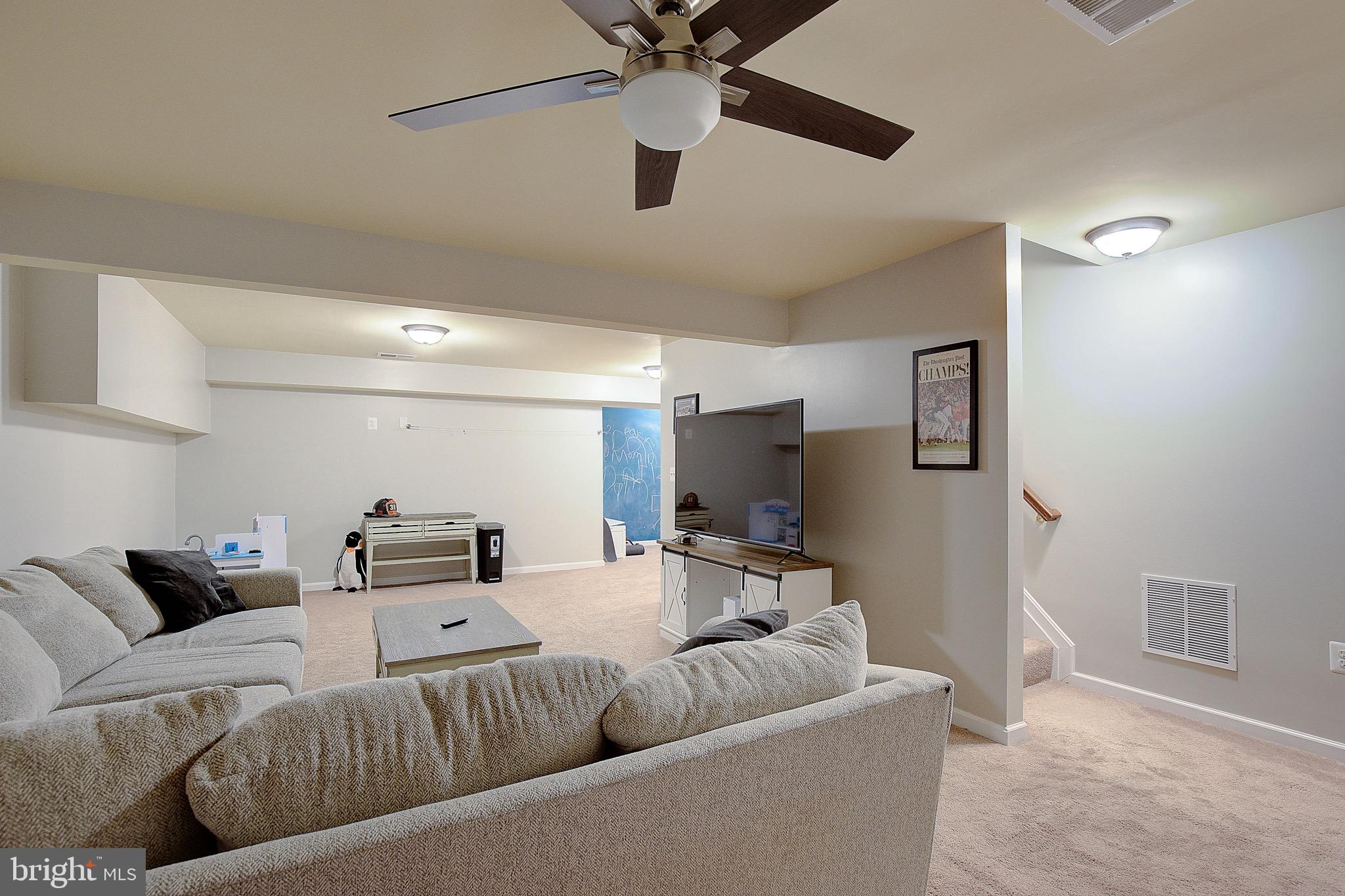 650 Stratton Place Prince Frederick, MD 20678 - Photo 33 of 51 a living room with furniture and a flat screen tv