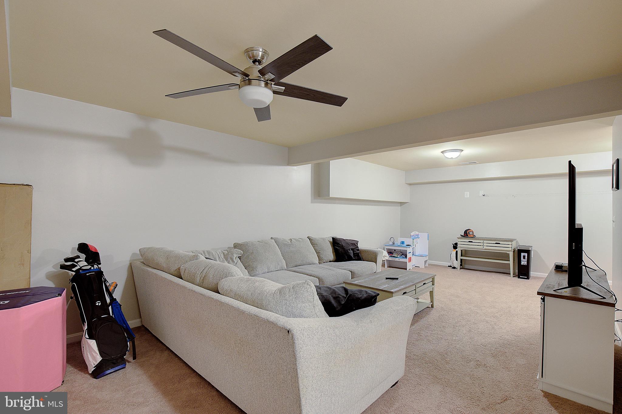650 Stratton Place Prince Frederick, MD 20678 - Photo 34 of 51 a living room with furniture and a flat screen tv