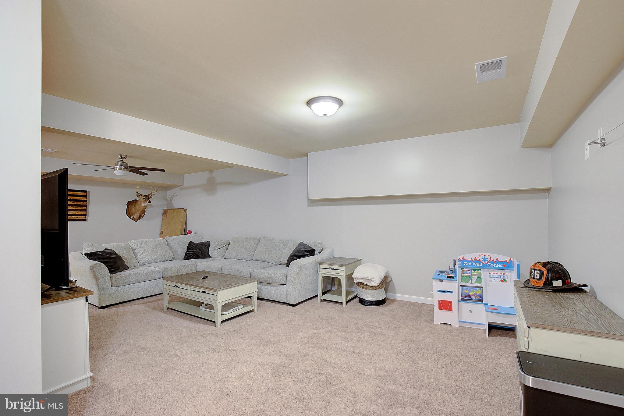 650 Stratton Place Prince Frederick, MD 20678 - Photo 36 of 51 a living room with furniture