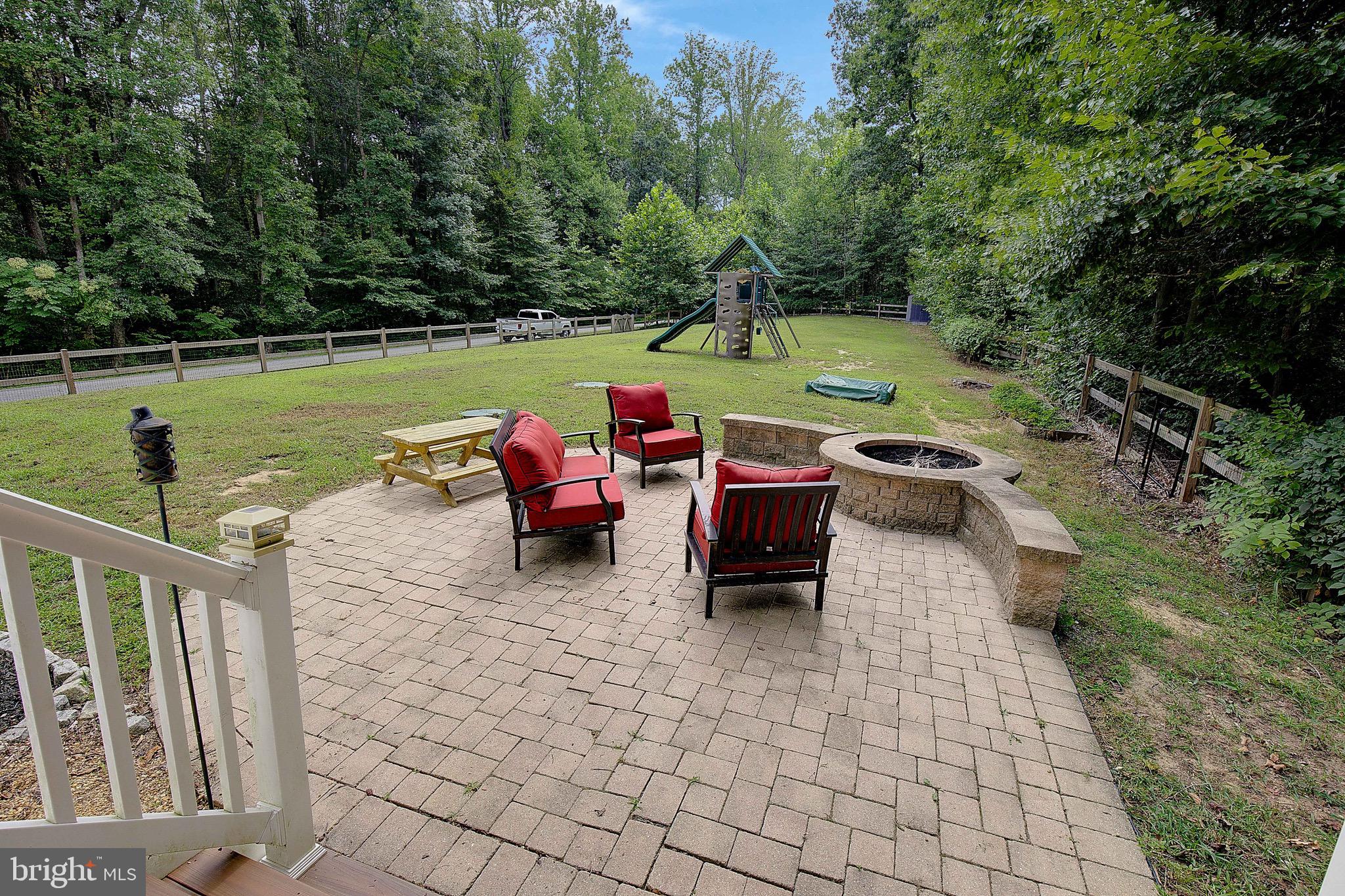 650 Stratton Place Prince Frederick, MD 20678 - Photo 4 of 51 a backyard of a house with yard and outdoor seating