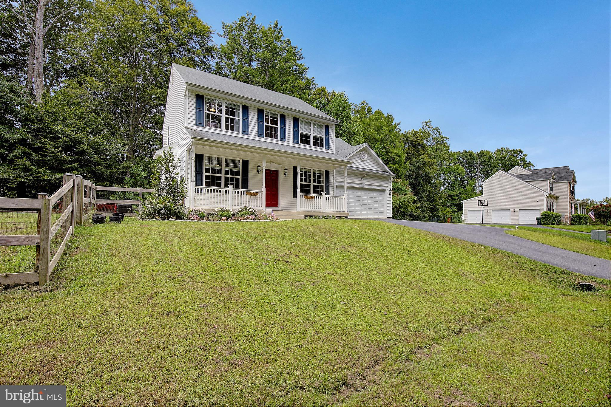 650 Stratton Place Prince Frederick, MD 20678 - Photo 42 of 51 a front view of house with outdoor seating and covered with trees
