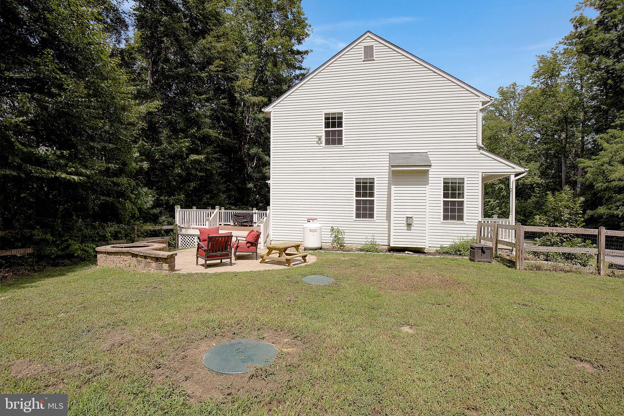 650 Stratton Place Prince Frederick, MD 20678 - Photo 47 of 51 a view of a house with a patio and a yard