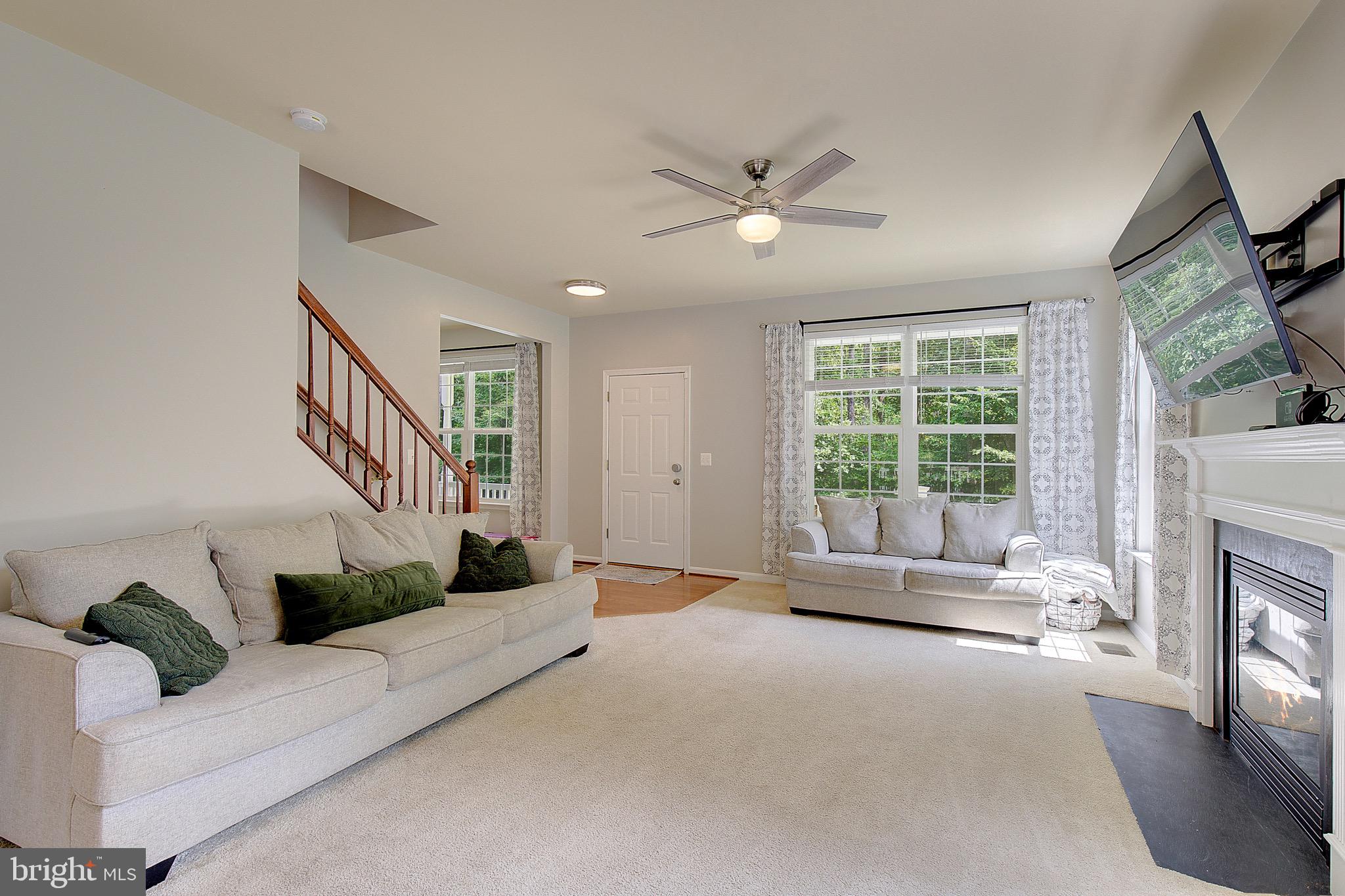 650 Stratton Place Prince Frederick, MD 20678 - Photo 9 of 51 a living room with furniture and a fireplace