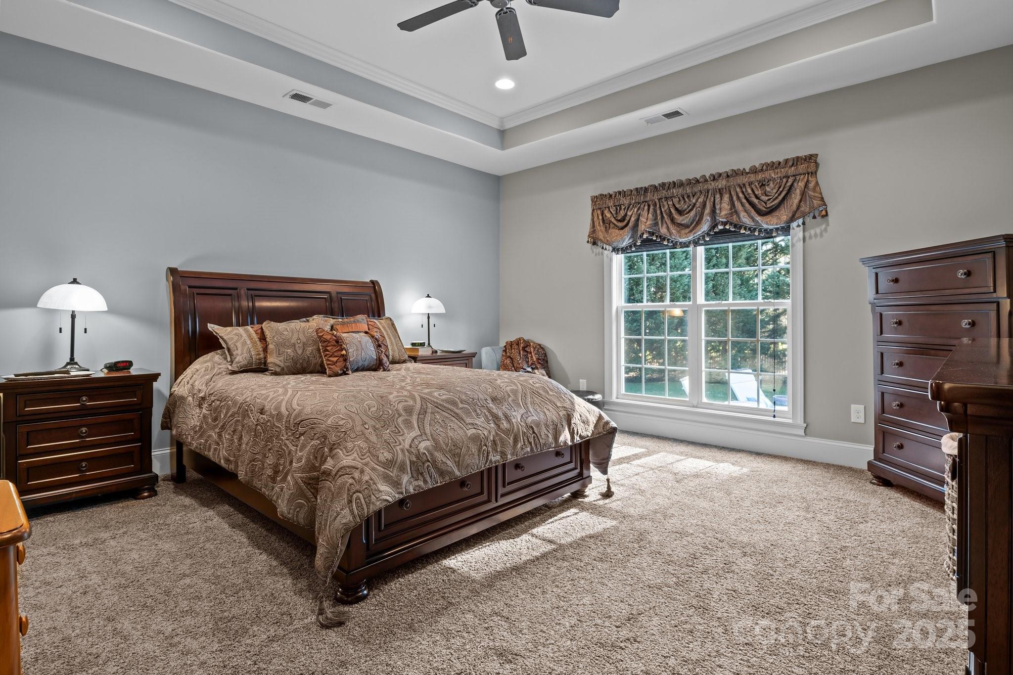 574 Barber Loop Mooresville, NC 28117 - Photo 14 of 34 a bed room with a bed and a tv