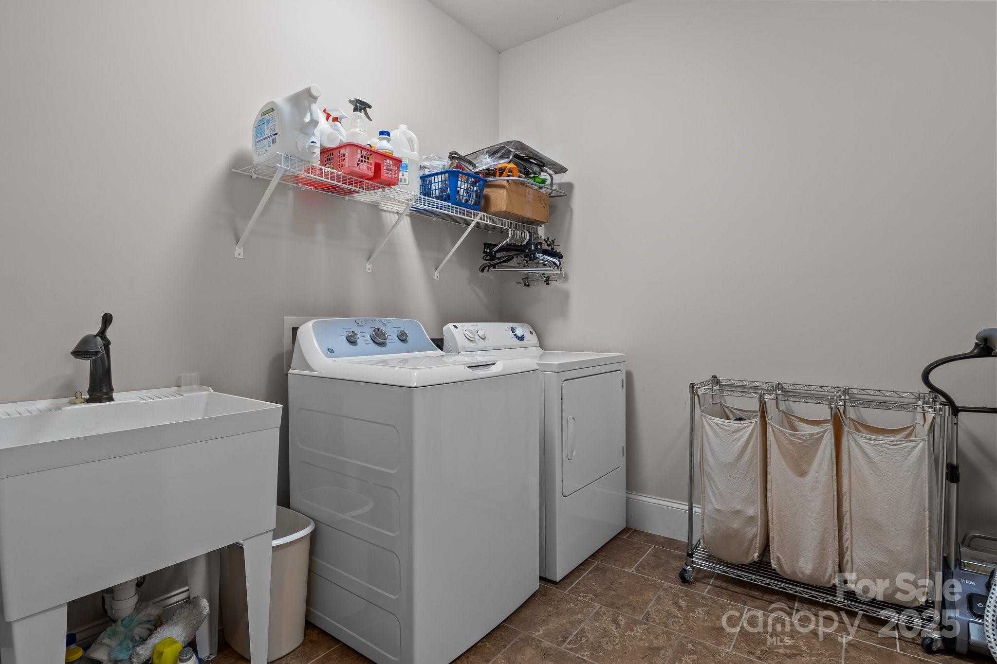 574 Barber Loop Mooresville, NC 28117 - Photo 22 of 34 a utility room with dryer and washer