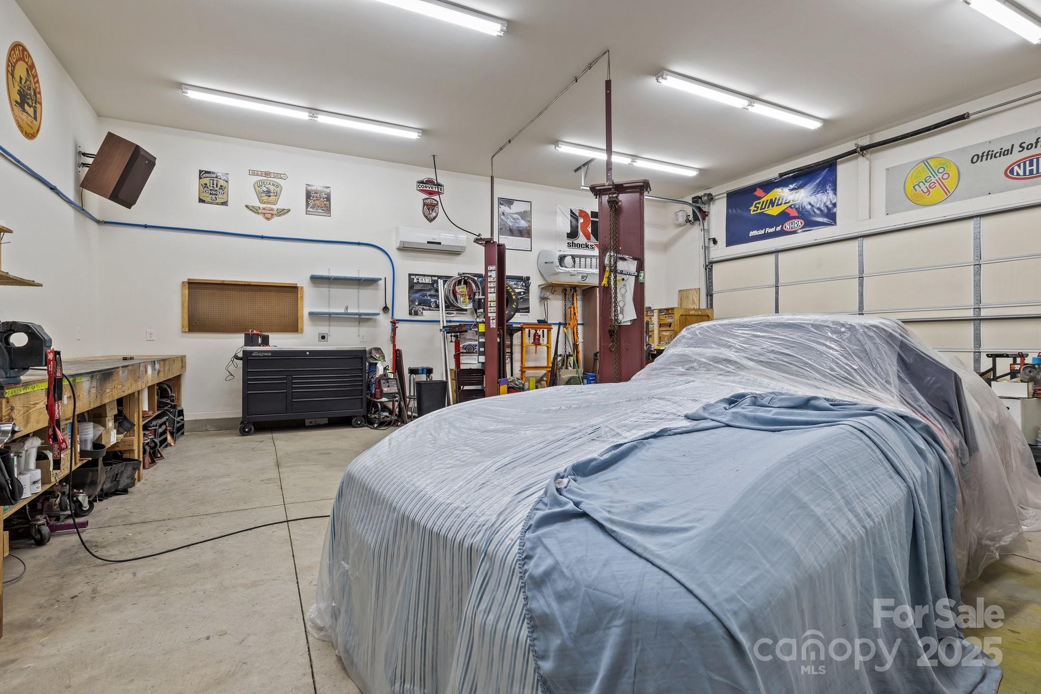 574 Barber Loop Mooresville, NC 28117 - Photo 32 of 34 a bed room with a bed and a television