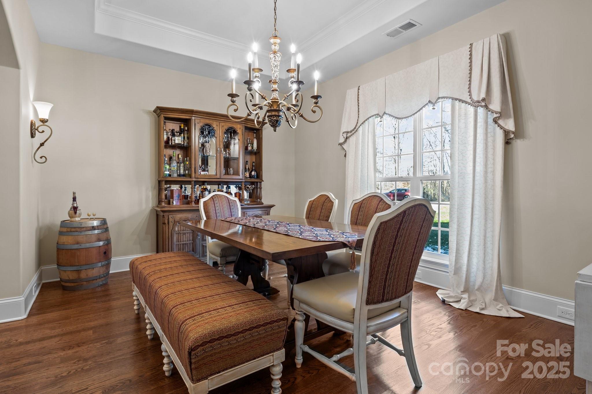 574 Barber Loop Mooresville, NC 28117 - Photo 5 of 34 a view of a dining room with furniture and chandelier