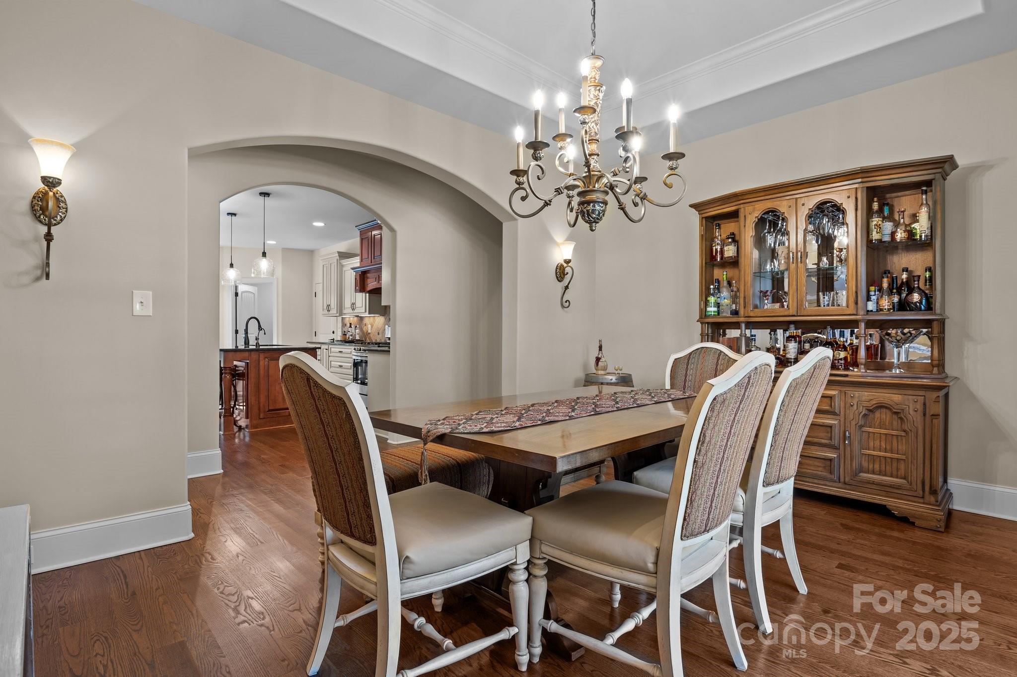 574 Barber Loop Mooresville, NC 28117 - Photo 7 of 34 a view of a dining room with furniture and chandelier