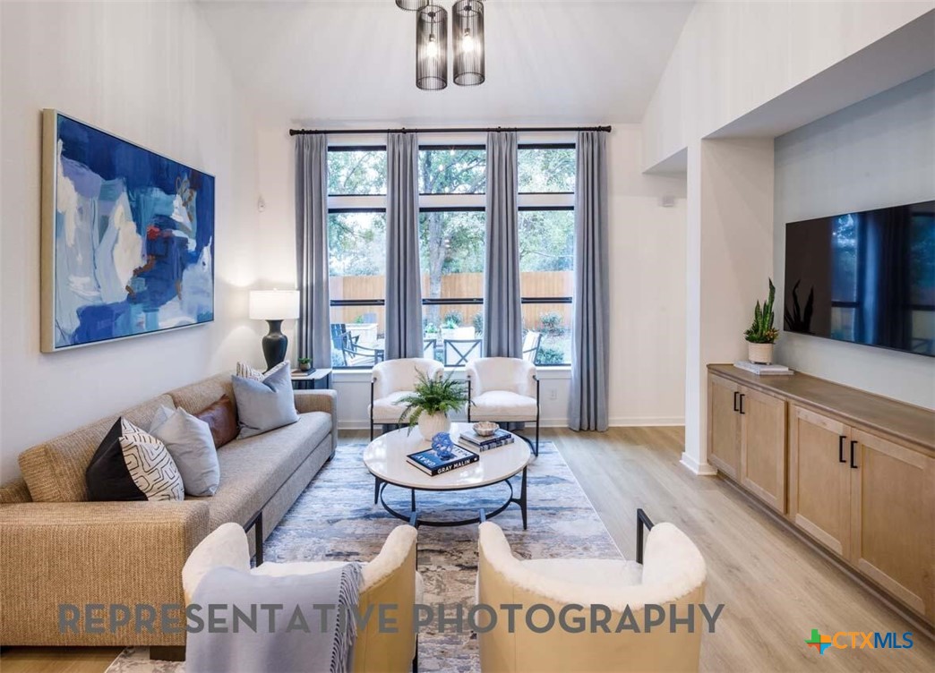 8808 Fallkill Drive Austin, TX 78744 - Photo 12 of 34 a living room with furniture and window