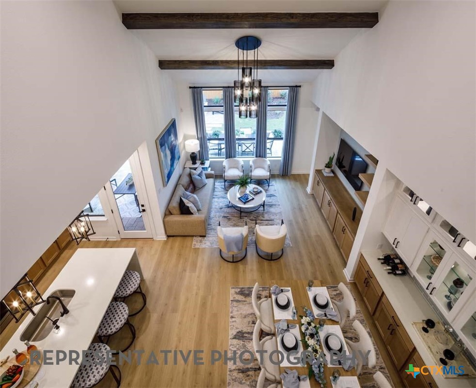 8808 Fallkill Drive Austin, TX 78744 - Photo 13 of 34 a view of a dining room with furniture a rug and wooden floor