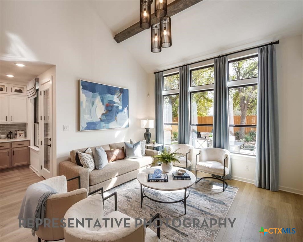 8808 Fallkill Drive Austin, TX 78744 - Photo 9 of 34 a living room with furniture and a large window