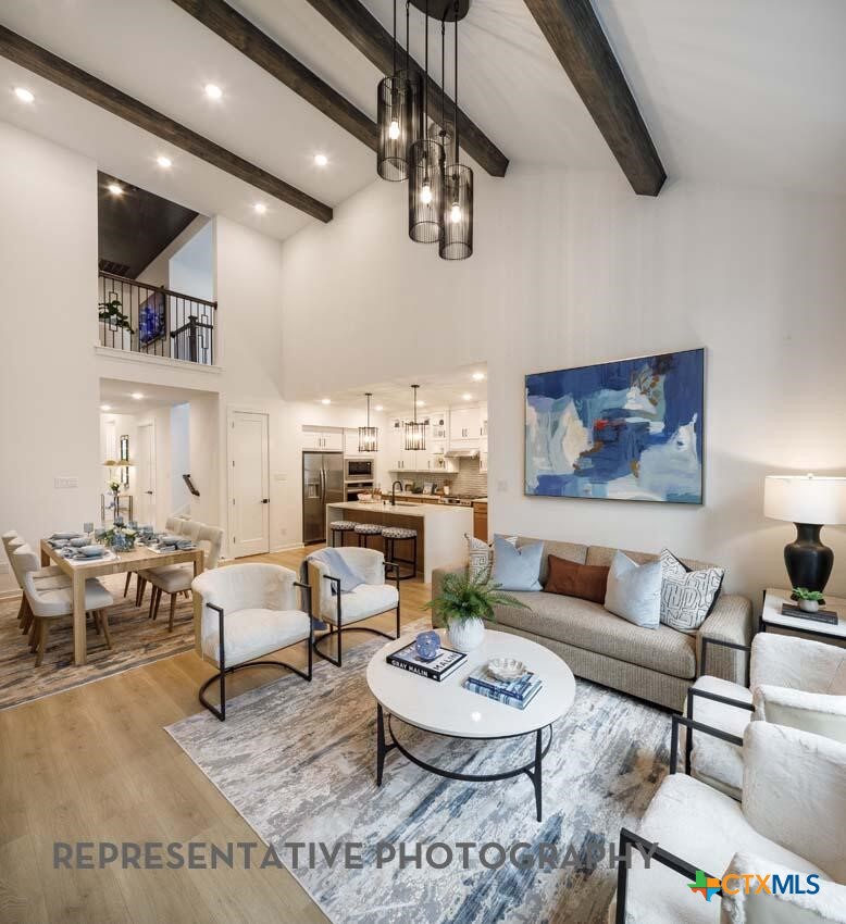 8808 Fallkill Drive Austin, TX 78744 - Photo 10 of 34 a living room with lots of furniture and kitchen view