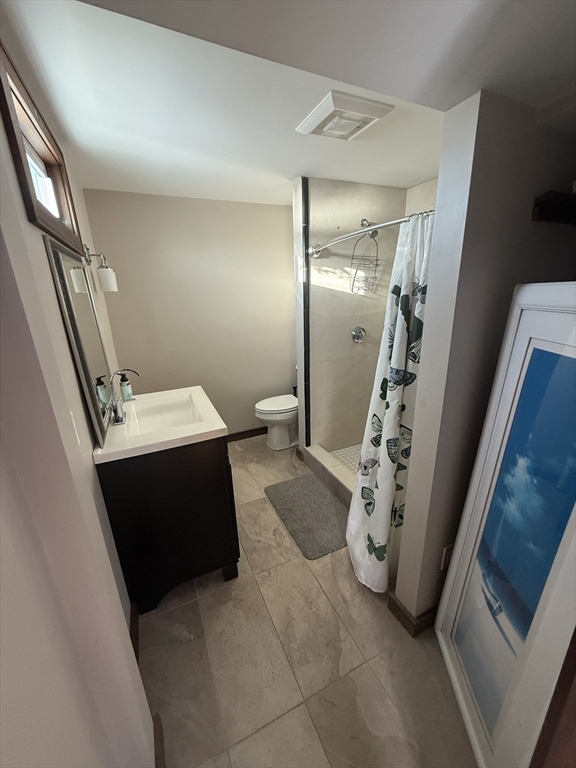 271 Central Avenue Scituate, MA 02050 - Photo 12 of 18 a bathroom with a sink and mirror