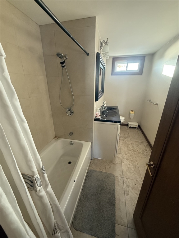 271 Central Avenue Scituate, MA 02050 - Photo 15 of 18 a bathroom with a tub a sink and shower