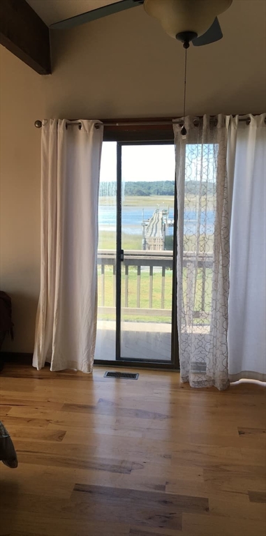 271 Central Avenue Scituate, MA 02050 - Photo 6 of 18 a view of a room with wooden floor and a window