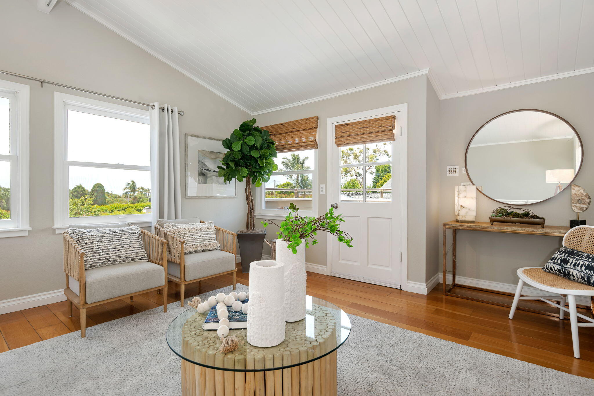 2129 Red Rose Way Santa Barbara, CA 93109 - Photo 14 of 44 a living room with furniture a potted plant and a large window