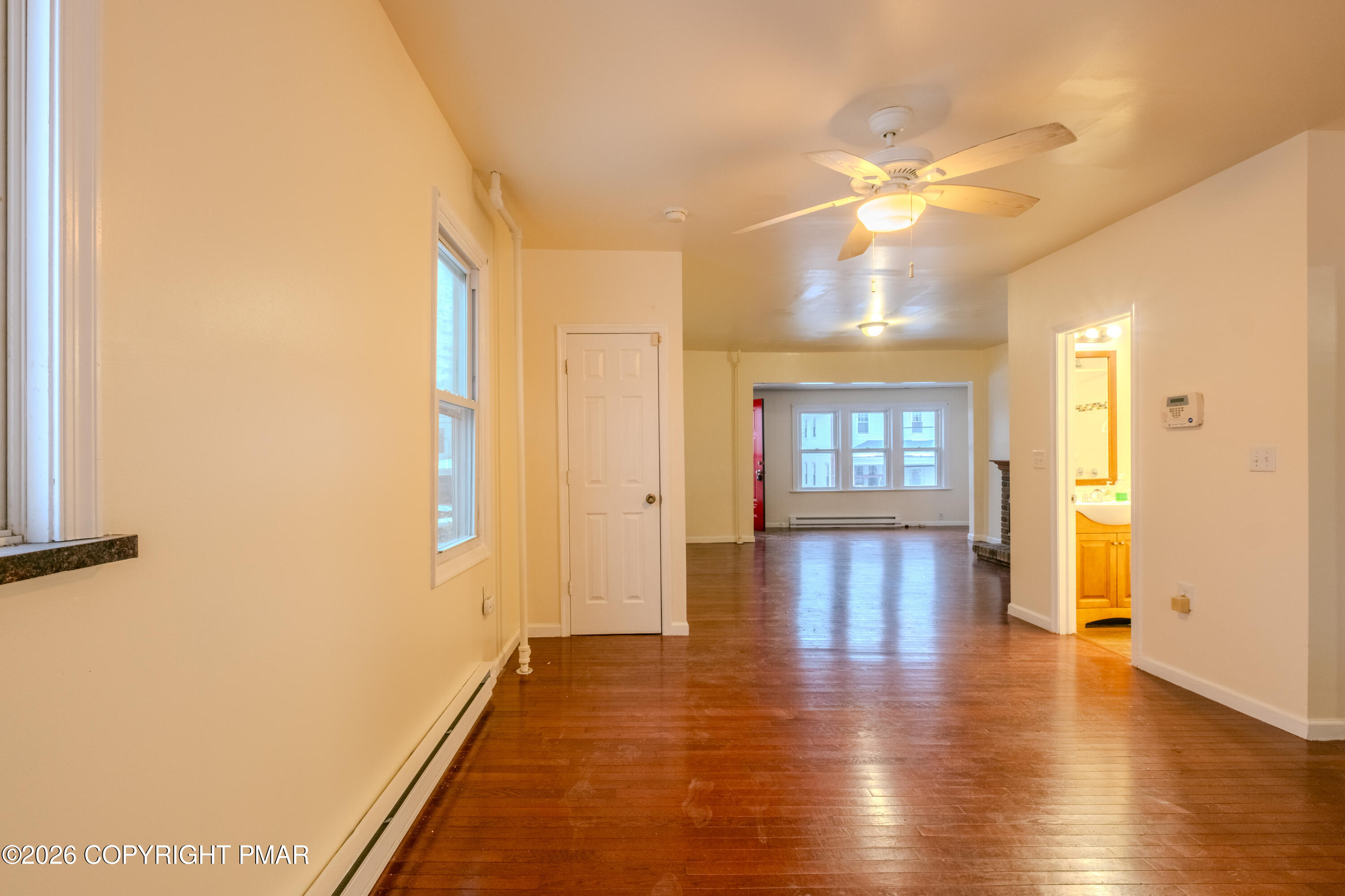 1042 Taylor Avenue Scranton, PA 18510 - Photo 11 of 40 a view of an entryway with wooden floor and a front door