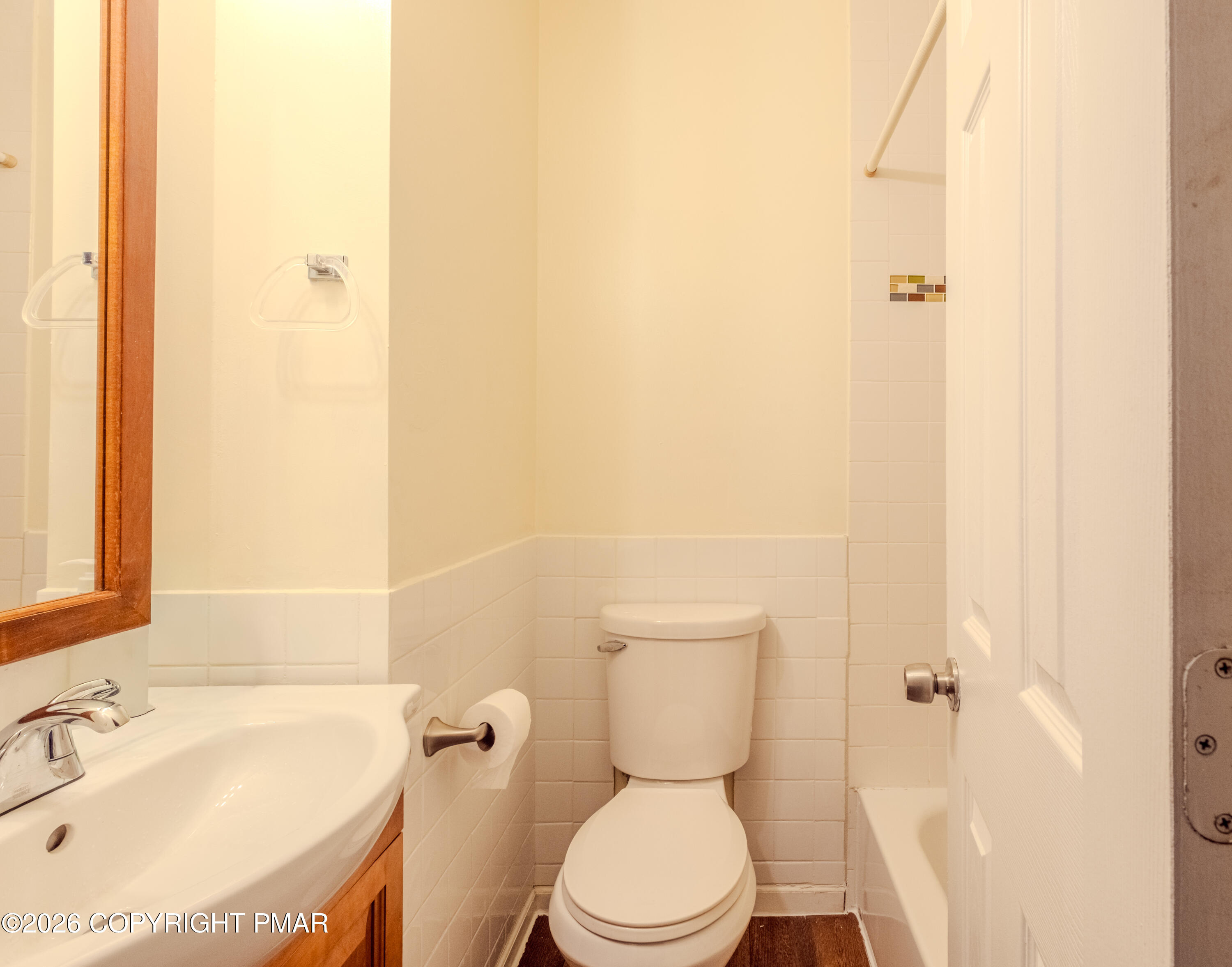1042 Taylor Avenue Scranton, PA 18510 - Photo 17 of 40 a white toilet sitting next to a bathroom sink