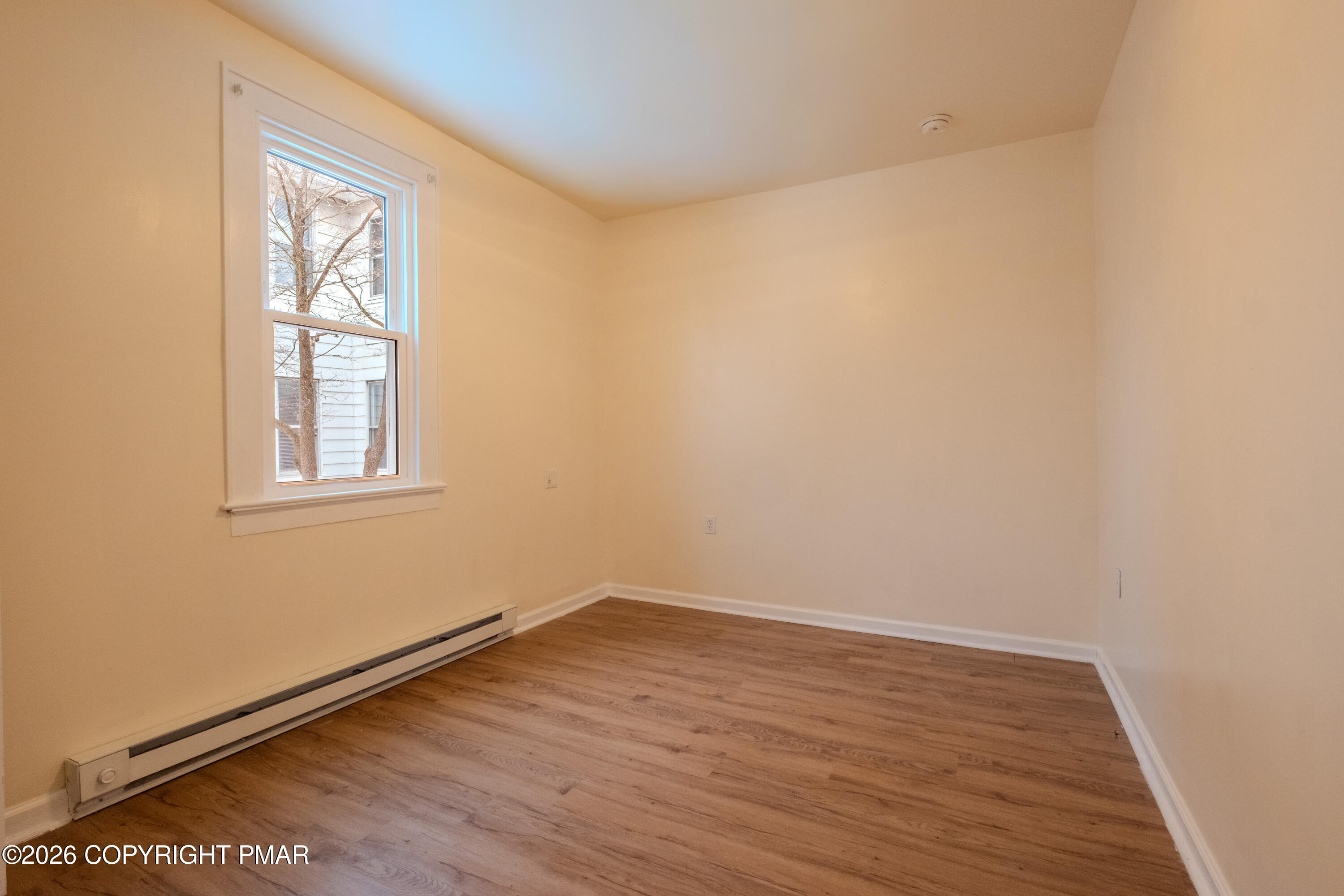 1042 Taylor Avenue Scranton, PA 18510 - Photo 21 of 40 wooden floor in an empty room with a window