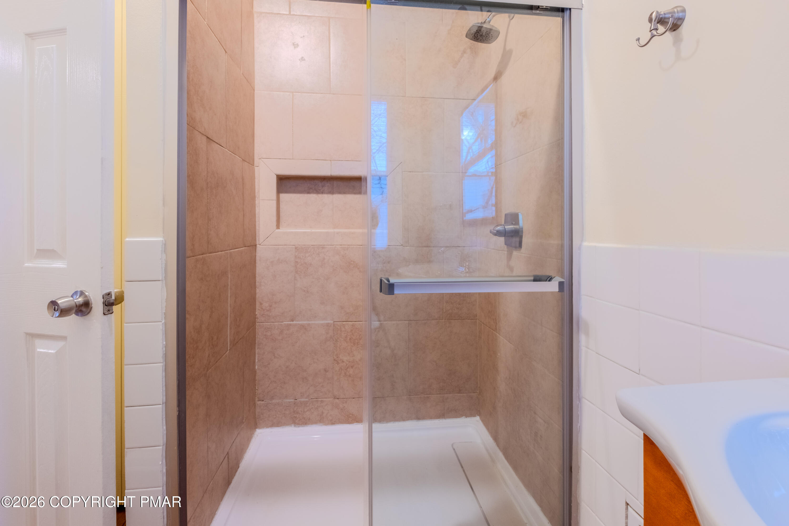 1042 Taylor Avenue Scranton, PA 18510 - Photo 25 of 40 a bathroom with a glass shower door