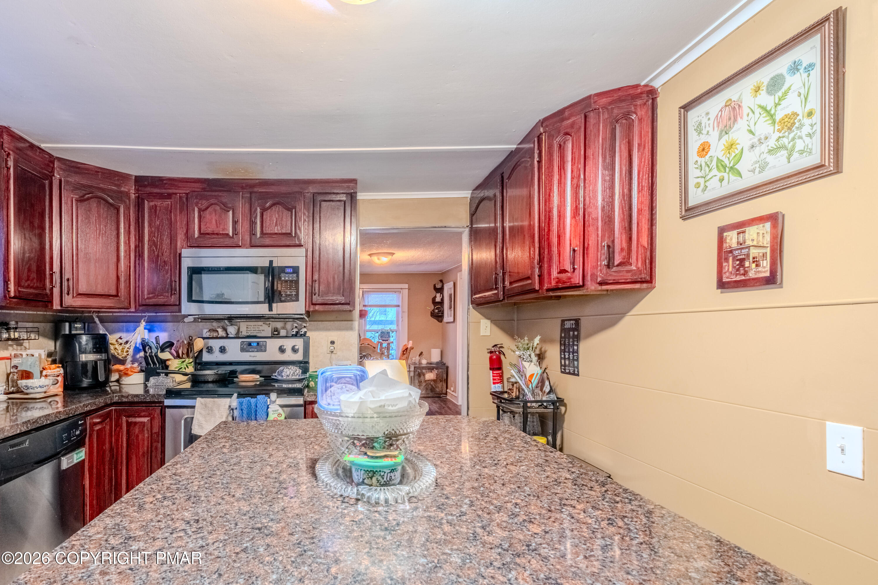 1042 Taylor Avenue Scranton, PA 18510 - Photo 33 of 40 a kitchen with stainless steel appliances granite countertop wooden cabinets a stove top oven a sink and dishwasher