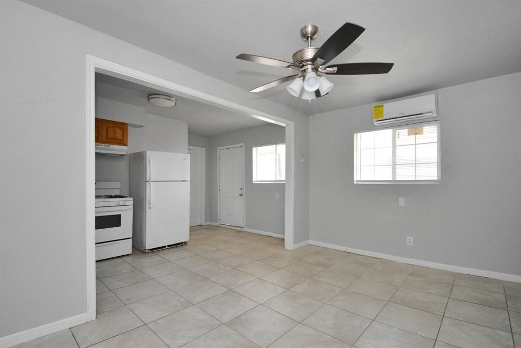 8127 Colonial Lane, Unit 2 Houston, TX 77051 - Photo 5 of 11 an empty room with closet and windows