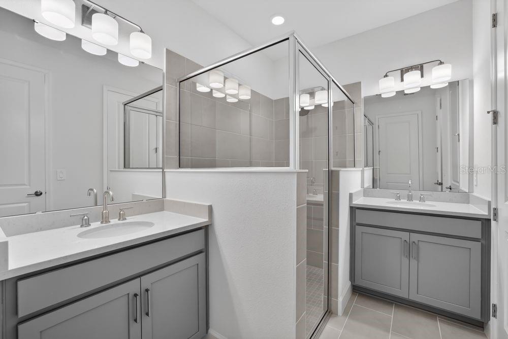 13505 Commons Avenue Parrish, FL 34219 - Photo 13 of 40 a bathroom with a sink double vanity and a mirror