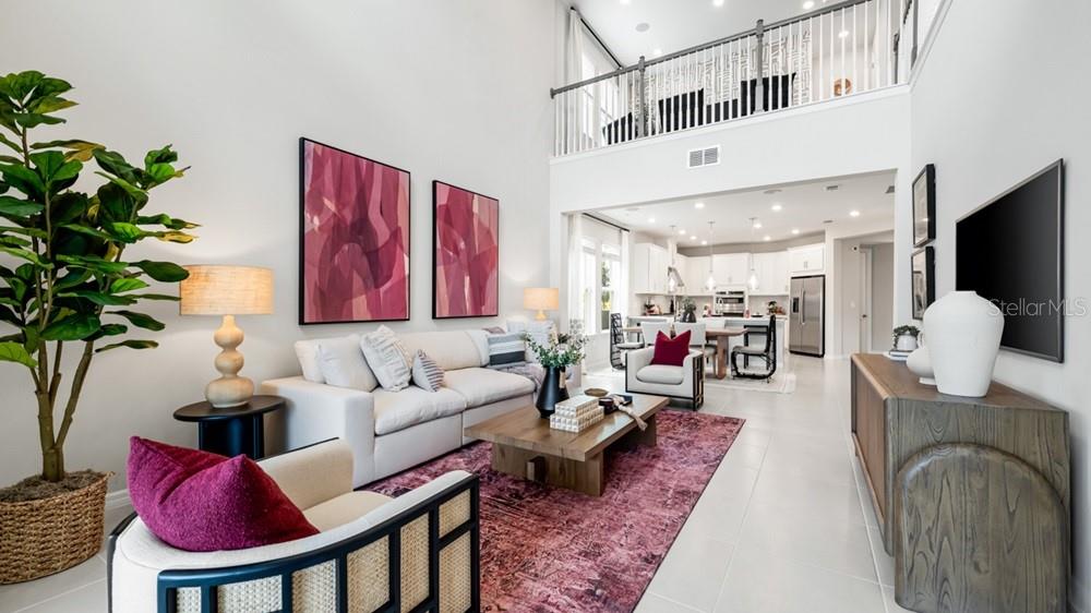 13505 Commons Avenue Parrish, FL 34219 - Photo 14 of 26 a living room with furniture and a potted plant