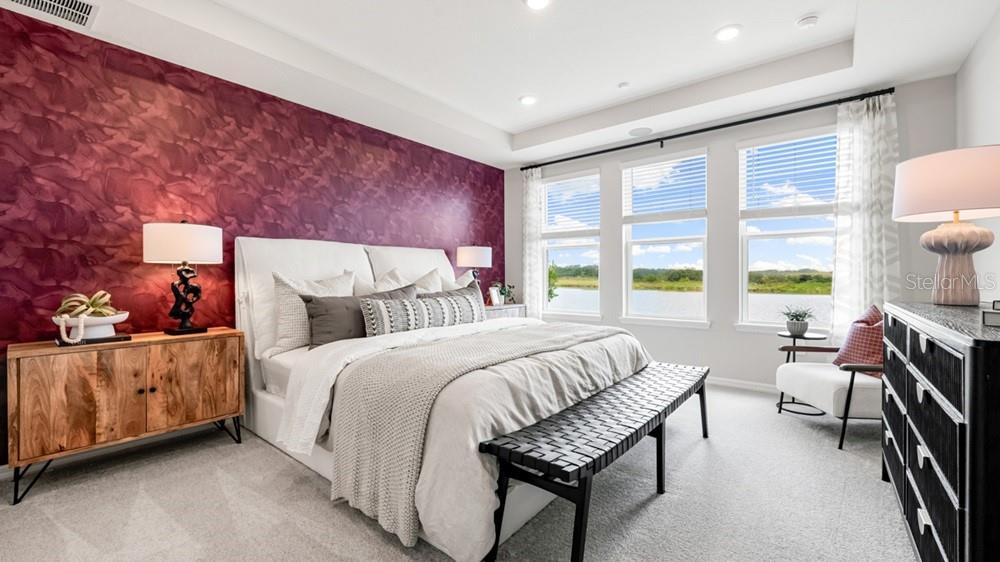 13505 Commons Avenue Parrish, FL 34219 - Photo 15 of 26 a bed room with a bed and a chair