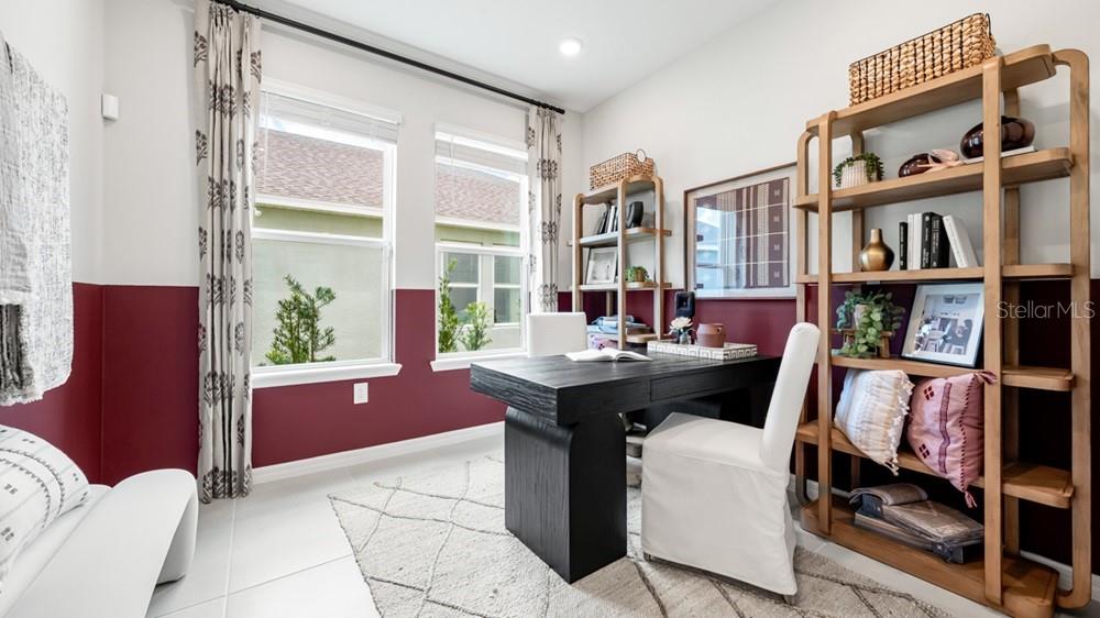 13505 Commons Avenue Parrish, FL 34219 - Photo 17 of 26 a view of a workspace with furniture and a book shelf