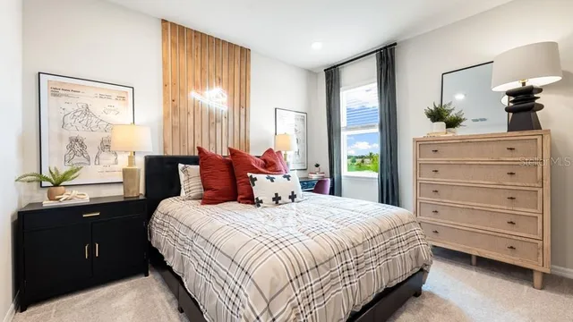 a bedroom with a bed and cabinets