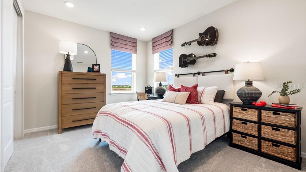 13505 Commons Avenue Parrish, FL 34219 - Photo 20 of 26 a bedroom with a bed and cabinets