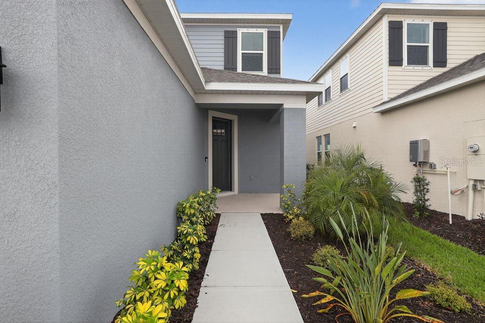 13505 Commons Avenue Parrish, FL 34219 - Photo 2 of 40 a view of a house with potted plants