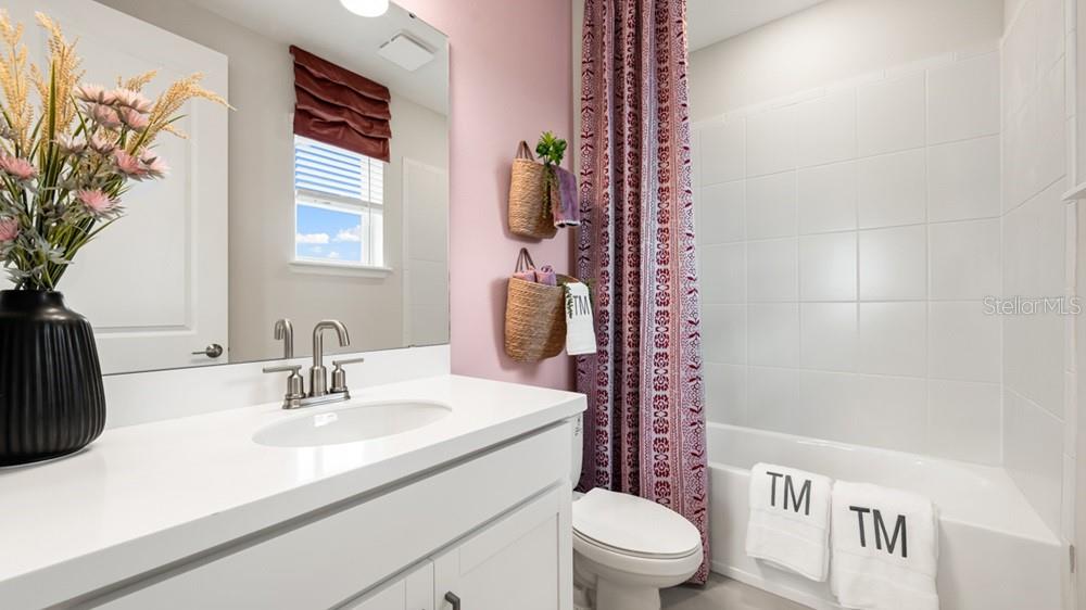 13505 Commons Avenue Parrish, FL 34219 - Photo 23 of 26 a bathroom with a sink toilet and shower