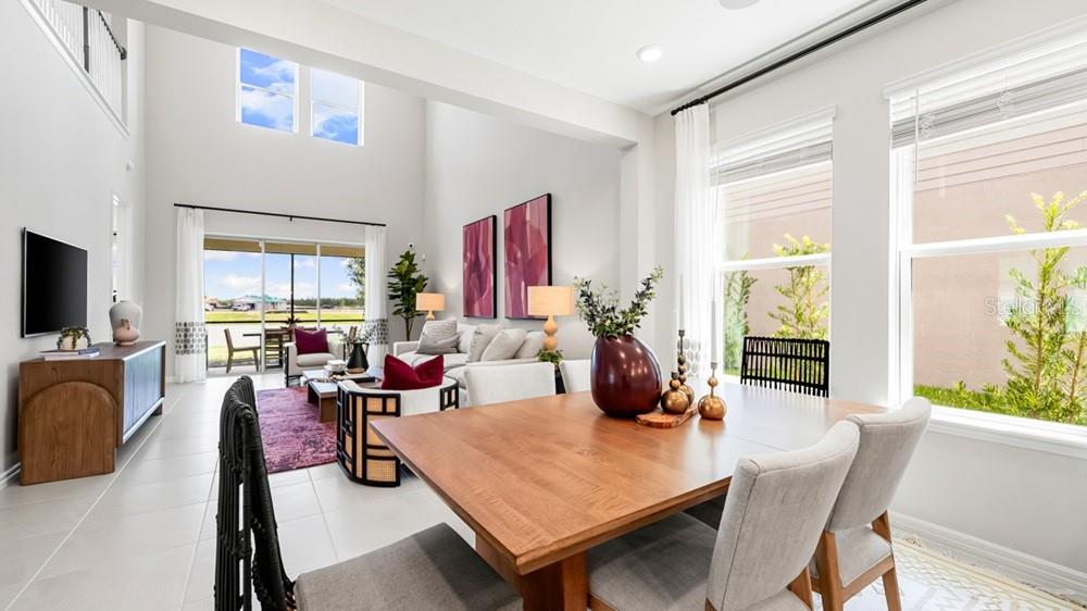 13505 Commons Avenue Parrish, FL 34219 - Photo 10 of 26 a living room with fireplace furniture and a flat screen tv