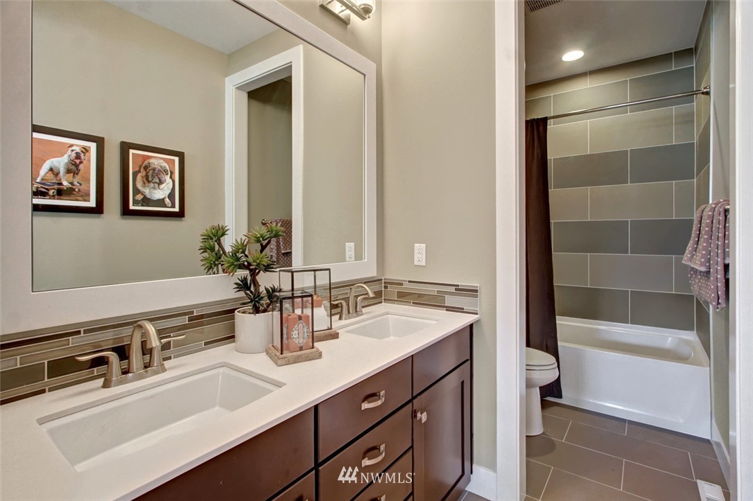 316 Field Place Southeast Renton, WA 98059 - Photo 14 of 16 a bathroom with a sink double vanity and a bathtub