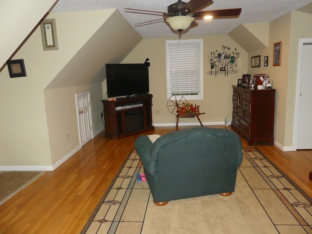 102 Coffey Hill Road Ware, MA 01082 - Photo 16 of 27 a living room with furniture and a flat screen tv
