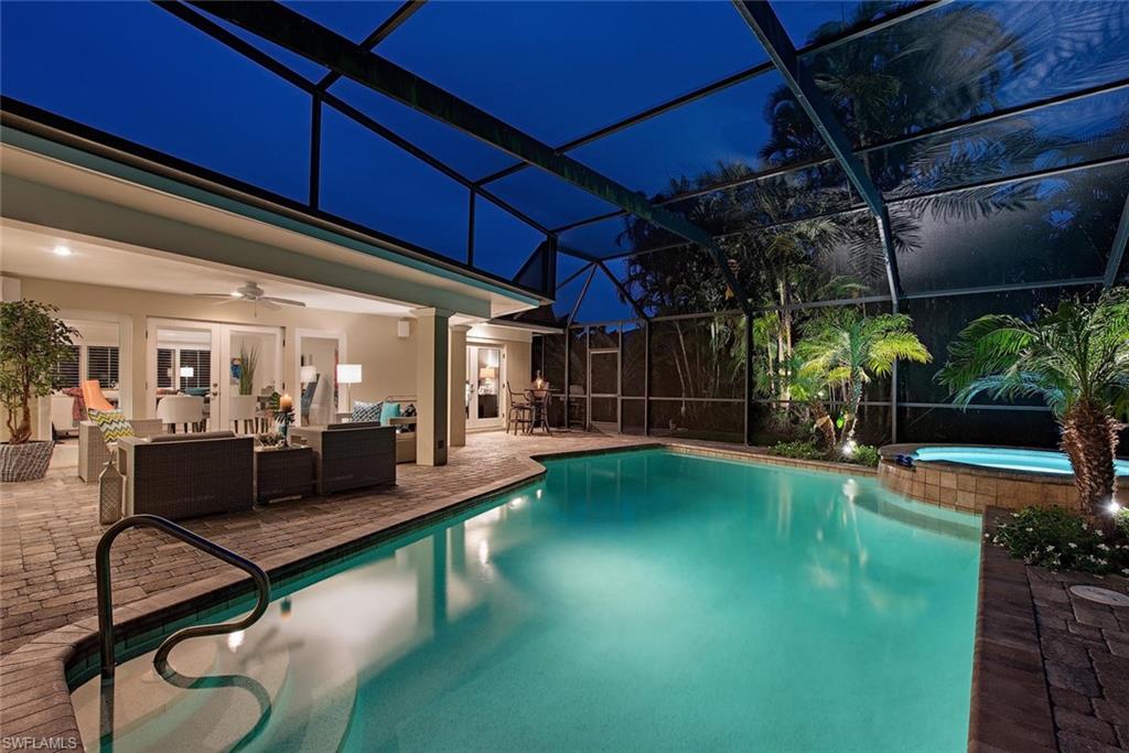 691 Ketch Drive Naples, FL 34103 - Photo 16 of 16 a view of a chairs and table in patio with swimming pool