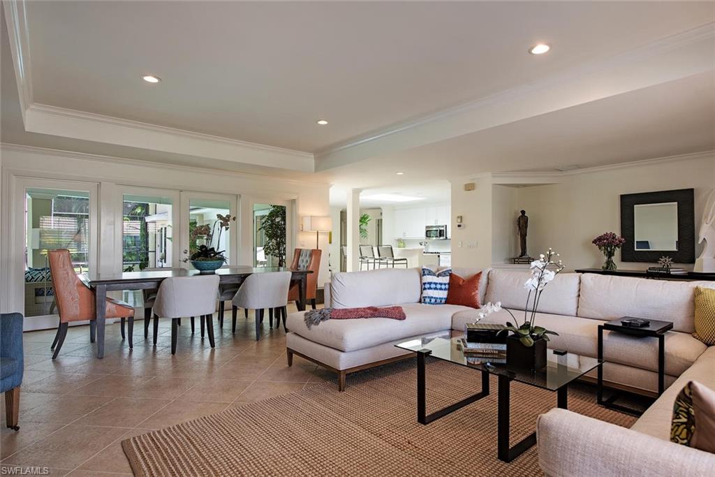 691 Ketch Drive Naples, FL 34103 - Photo 5 of 16 a living room with furniture a rug and a table