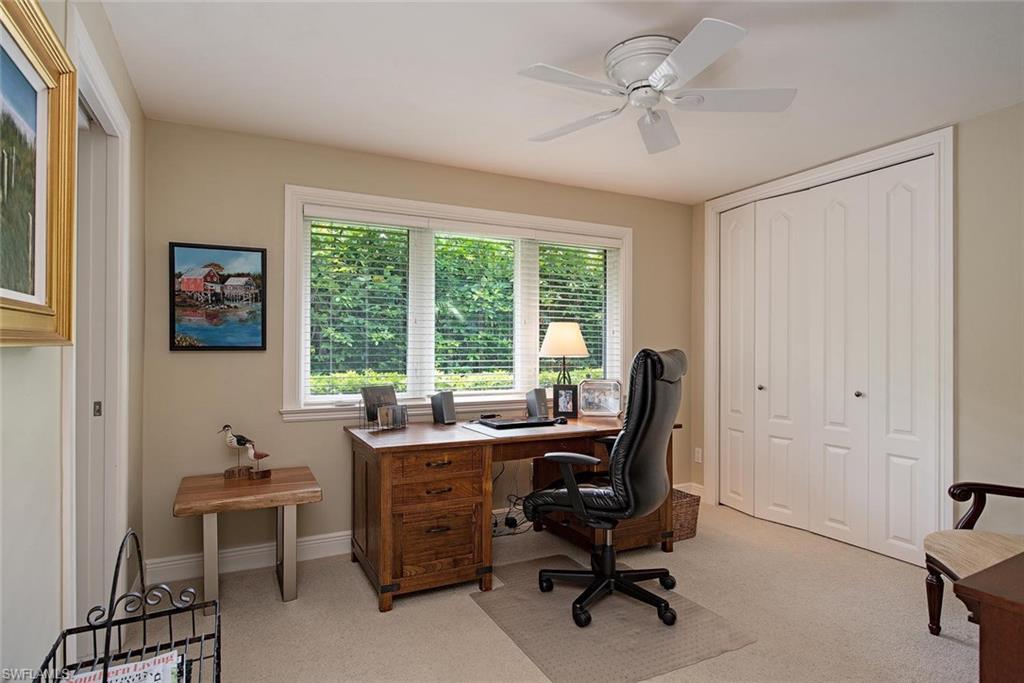 691 Ketch Drive Naples, FL 34103 - Photo 8 of 16 a view of a workspace with furniture and a window