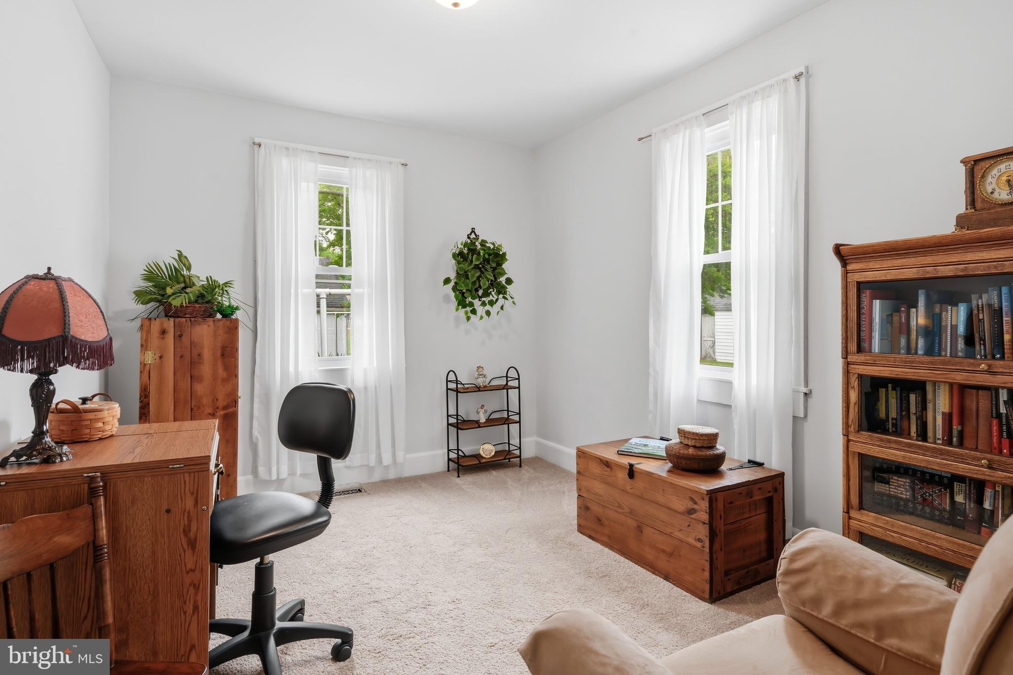 207 Crusader Road Cambridge, MD 21613 - Photo 34 of 76 a living room with furniture and a potted plant