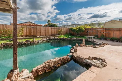 a view of a backyard with sitting area