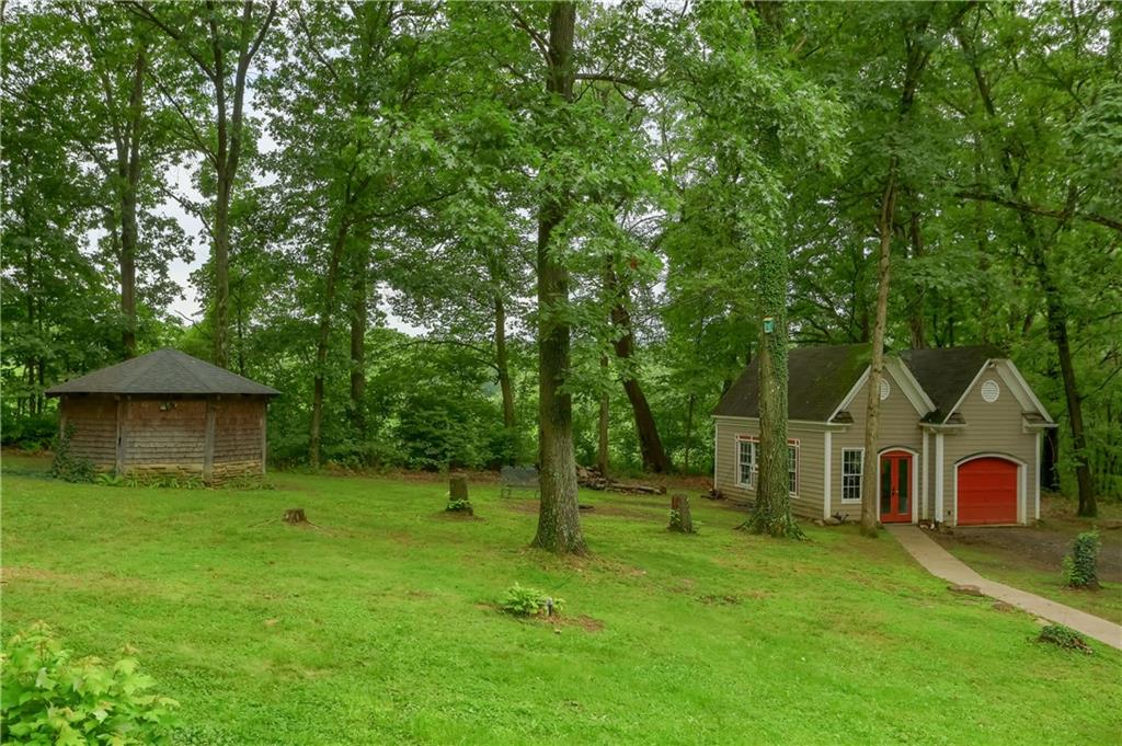 2064 Dime Road Vandergrift, PA 15690 - Photo 23 of 25 a front view of a house with a yard and trees