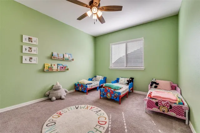 a bedroom with bed and window