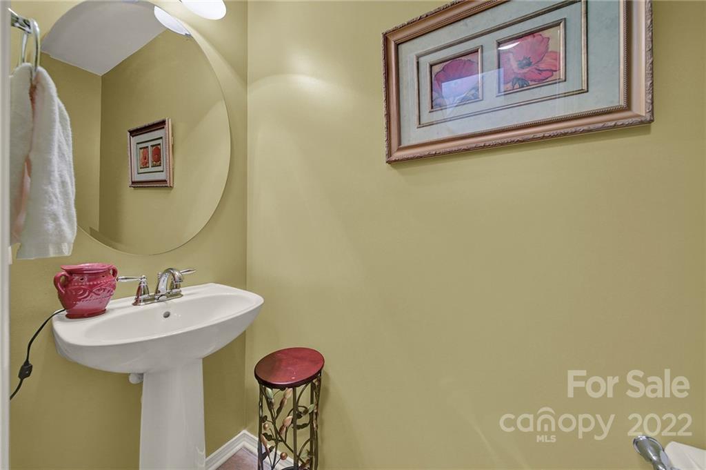 423 Hunters Dance Road Fort Mill, SC 29708 - Photo 8 of 25 a bathroom with a sink and a mirror